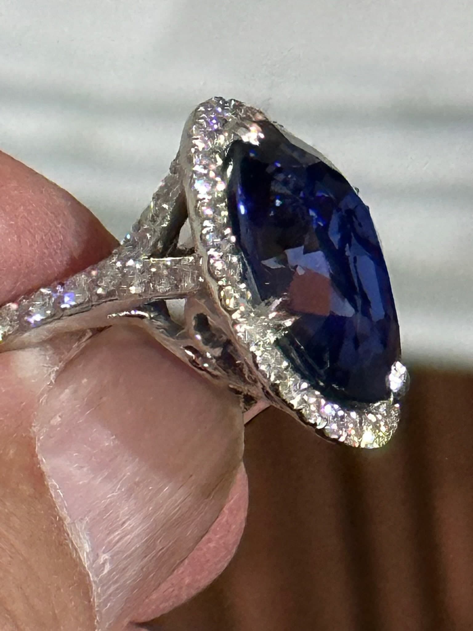 Tanzanite cushion-cut with diamond halo